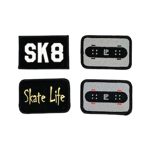 May include: Four embroidered patches with a skateboarding theme. Two black patches feature white text: "SK8" and "Skate Life". The other two are grey with a skateboard design and the letters "IP".