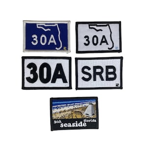 May include: Five rectangular embroidered patches. Two feature a blue or white background with a Florida state outline and the text 30A. One patch displays 30A in black on white. One shows SRB in black on white. One depicts a beach scene with 30A seaside florida.