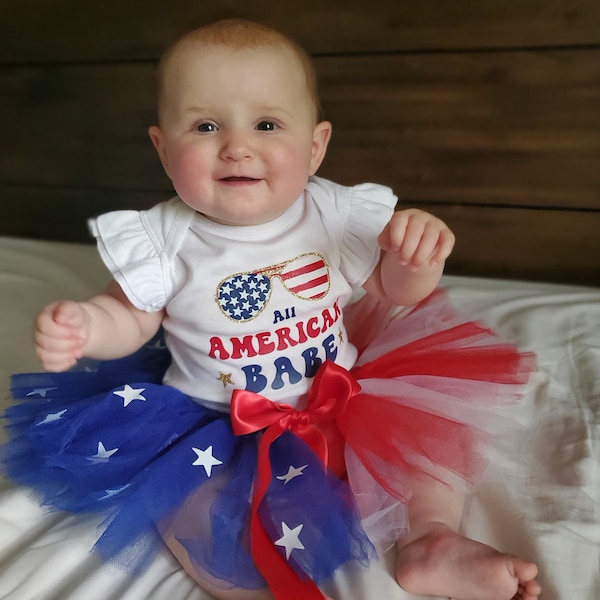 All American Babe: Baby Girl Flutter Sleeve Glitter 4th of July Bodysuit with American Flag Tutu
