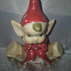 Pixies chilling on a logs Very Collectible! Rare Vintage Figurine Elf in Red Suit these are hard to find.