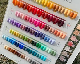 May include: A display of 78 nail polish colors in a variety of shades, including white, yellow, orange, red, pink, purple, blue, green, brown, and gray. The display is labeled "XINYOULI" and "78 colors".