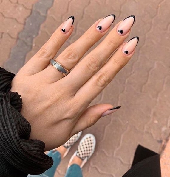 black nails with heart design