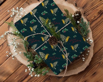 May include: Blue gift wrap with a repeating pattern of yellow birds, holly leaves and red berries. The text "Merry Christmas" is written in red on the wrapping paper. The gift is tied with twine.