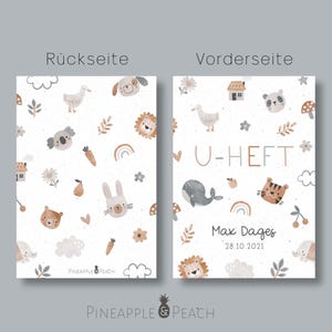 May include: A white card with a light brown and gray animal pattern on the back and the text "U-HEFT" on the front. The front also has the text "Max Dages 28.10.2021".