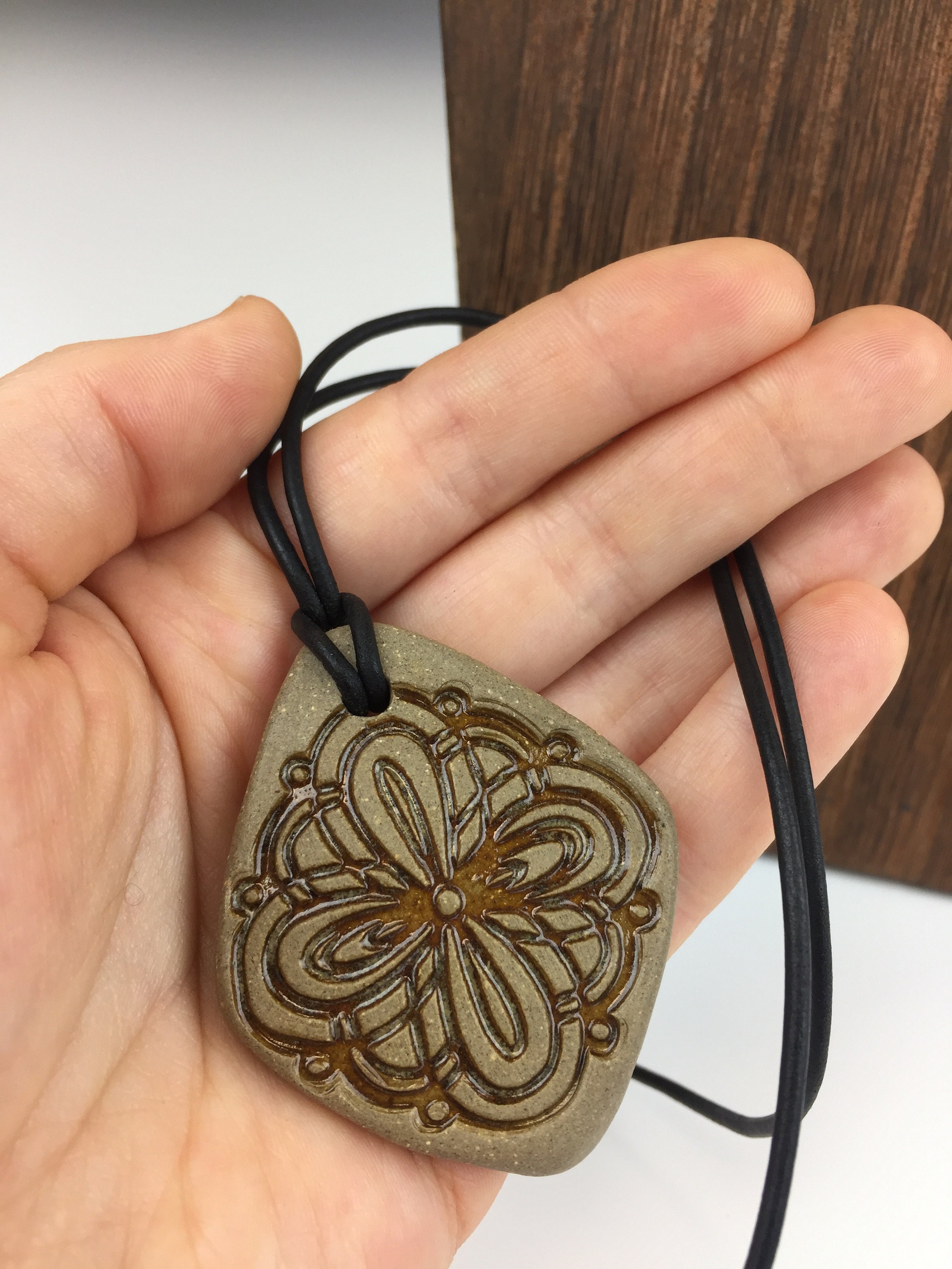 Handmade Ceramic Pendant Necklace With Stamped Design. Adjustable