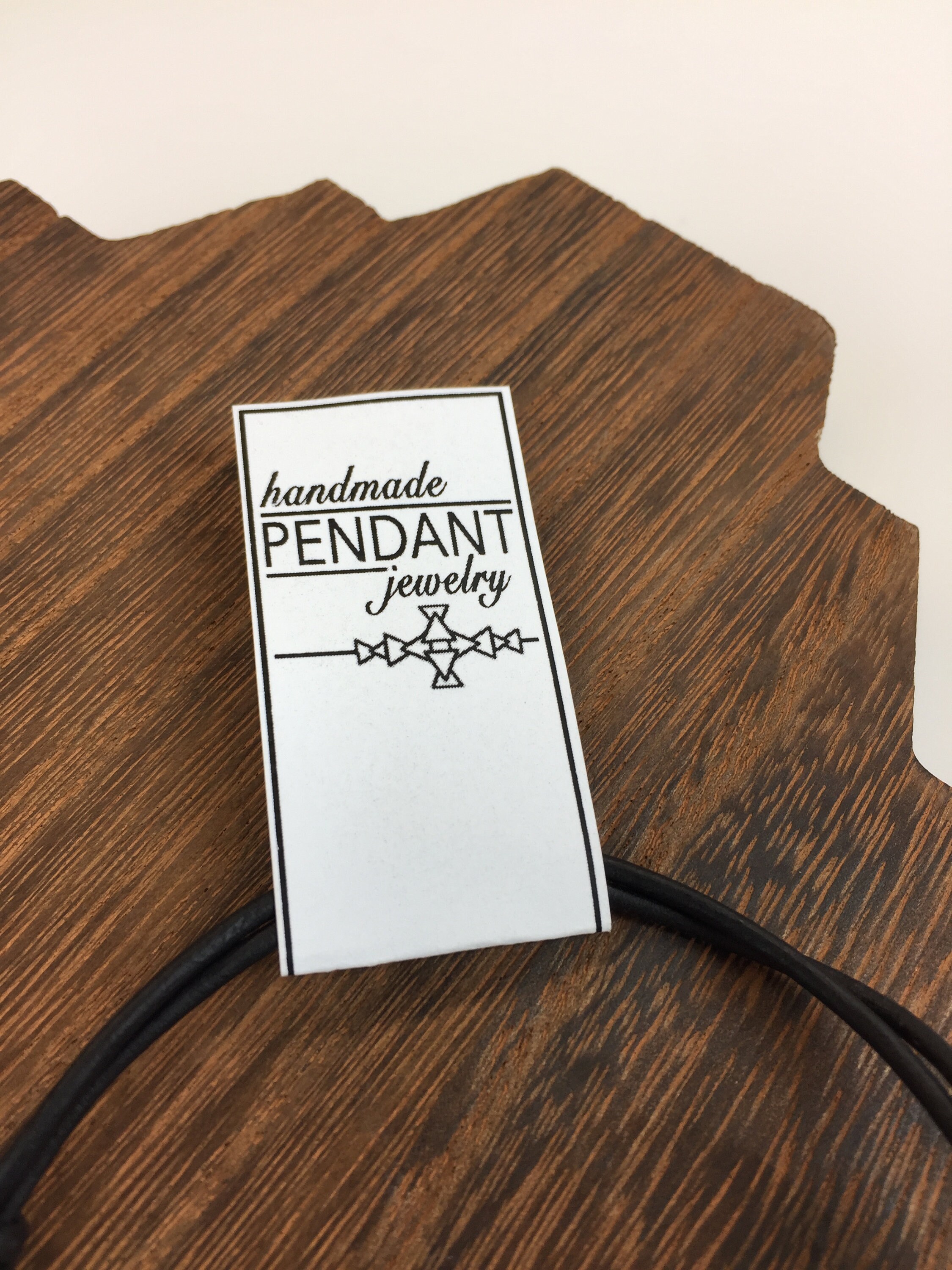 Handmade Ceramic Pendant Necklace With Stamped Design. Adjustable