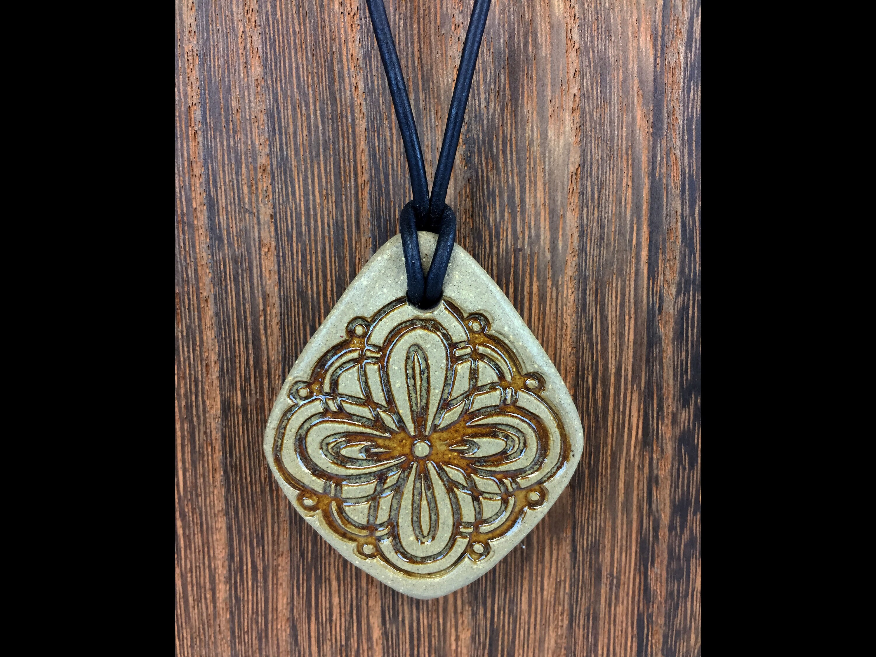 Handmade Ceramic Pendant Necklace With Stamped Design. Adjustable