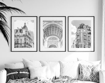 May include: Three black and white framed photographs of Parisian architecture. The left and right photos show buildings with ornate details, while the center photo shows a close-up of an arched doorway.