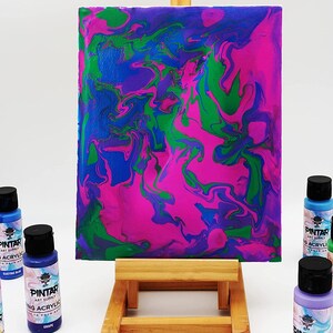 Abstract painting created using colorful pouring paints