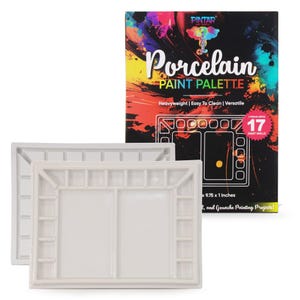 May include: Two white porcelain paint palettes with multiple wells for mixing colors. A box behind the palettes reads "Porcelain Paint Palette" and "17 Paint Wells". The box also states the palette is 9.75 x 1 inches.