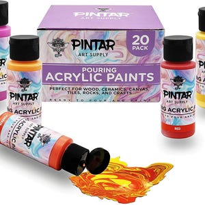 High flow paint pouring smoothly onto canvas creating abstract patterns