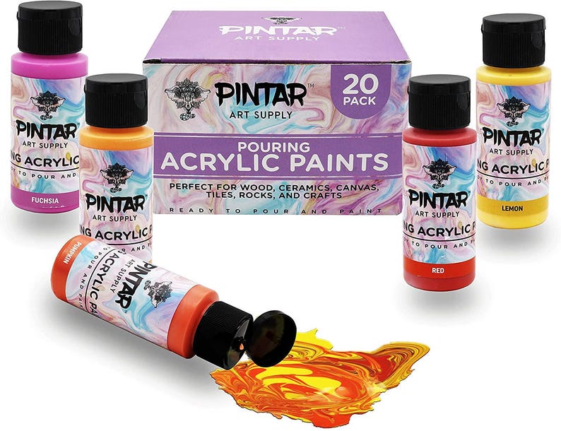 High flow paint pouring smoothly onto canvas creating abstract patterns