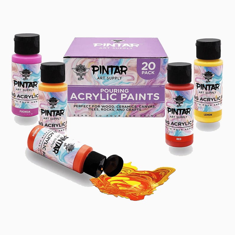 Set of 20 colorful acrylic pouring paint bottles arranged for art
