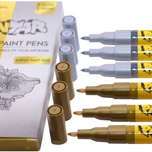 Metallic acrylic paint pens for rock, wood, glass, and canvas art.