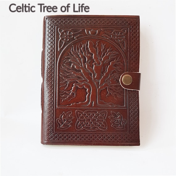 Hand-embossed Tree of Life leather grimoire with a medieval aesthetic — this looks like it was pulled from a fantasy market stall, not a print-on-demand factory.