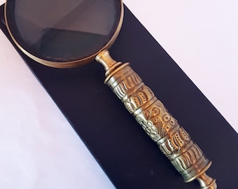 Vintage style magnifying glass with a  medieval look tooled brass handle. Old world charm. Read small print easily on food and meds labels.