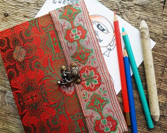 Vintage fabric sketchbook journal 5 by 7 inches. One of a kind blank book with artisan paper pages. Medieval look bronze metal lock closure.