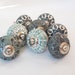 Verdi collection of 8 hand painted designer cupboard drawer knobs in exclusive botanical patterns. Standard 1.5 inch diameter size. 