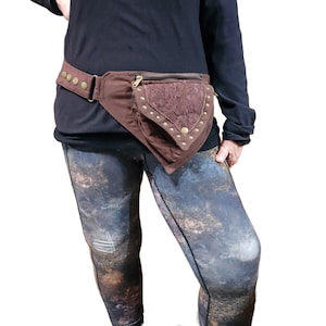 Dark Brown Utility Pocket Hip Belt. Adjustable to 48 inches waist/hip. Large 7 by 7 inch  front zipper pouch. 2  hidden zip compartments.