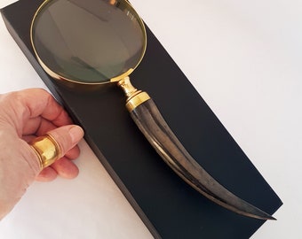 Vintage style magnifying glass hand lens with a curled horn handle. Old world charm. Read small print easily, use for home & hobby. 10 inch.