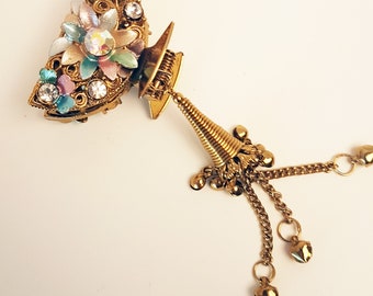 Vintage rhinestone gold metal claw clip barrette. Antique hair jewelry. Flower design hair clamp studded with rosegold & blue rhinestones.