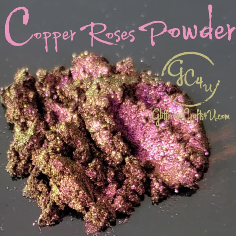 May include: Copper Roses Powder, a fine, shimmery powder with a copper and rose gold colour. The powder is piled high in a mound, showing its texture and sparkle. The text "GC4U Glitter Crafts4U.com" is visible in the lower right corner.