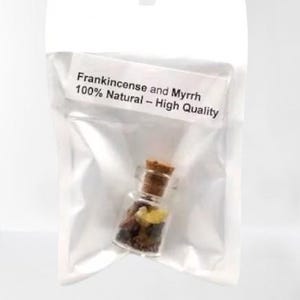 May include: A small glass jar with a cork lid filled with frankincense and myrrh. The jar is packaged in a clear plastic bag with a label that reads "Frankincense and Myrrh 100% Natural - High Quality".