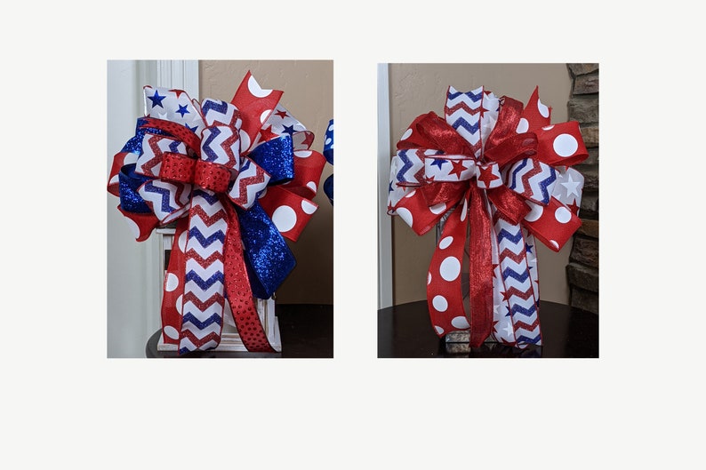 May include: Two red, white and blue ribbon bows with a chevron pattern, white polka dots and blue glitter. The bows are tied together and are on a white surface.