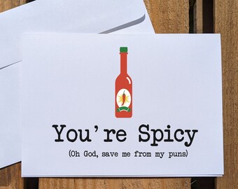 May include: White card with a red hot sauce bottle illustration and the text "You're Spicy (Oh God, save me from my puns)"