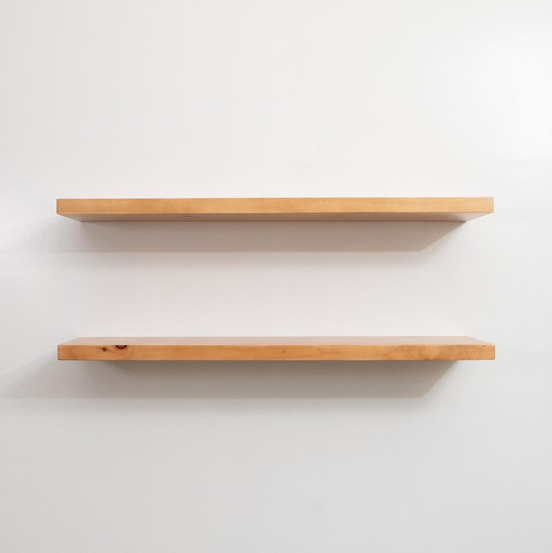 Two Wooden Aged Oak Floating Shelves on a Wall. Heavy duty shelves with floating bracket included.