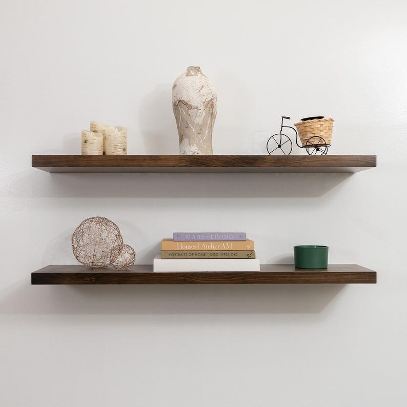 Two Wooden Jacobean Floating Shelves on a Wall with Books and Decorations. Heavy duty shelves with floating bracket included.