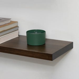 Wooden Jacobean Floating Shelf on a Wall with Books and Decorations. Heavy duty shelf with floating bracket included.