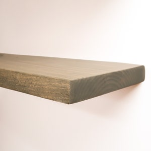 Wooden Aged Barrel Floating Shelves on a Wall. Heavy duty shelf with floating bracket included.