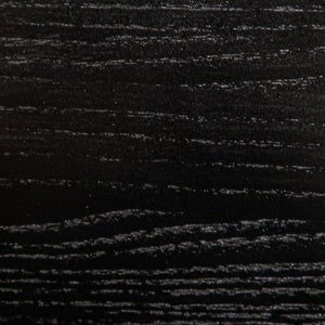 May include: Black woodgrain texture with a smooth, polished finish.