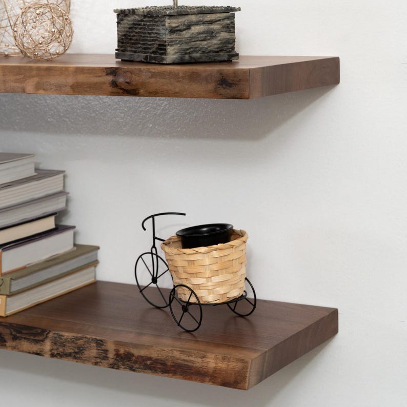Walnut Live Edge Floating Shelves with Decorations on a Gray Wall