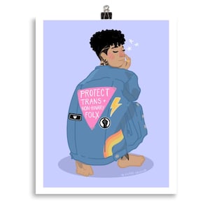 May include: Illustration of a person wearing a blue denim jacket with the text "PROTECT TRANS + NON-BINARY FOLX" on the back. The jacket features a pink triangle, a lightning bolt, and a rainbow. The person is squatting on a light purple background.