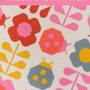 May include: A quilt pattern with a spring theme. The design features colorful geometric flowers, ladybugs, and leaves in shades of red, pink, yellow, and blue on a white background. The text "HELLO SPRING" is displayed in pink. The pattern is for advanced beginners.