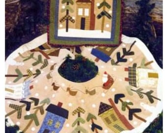 May include: A beige and white quilted Christmas tree skirt with a white trim. The skirt features a variety of appliques, including houses, trees, and snowmen. The skirt is decorated with white polka dots and a red and white Santa Claus applique in the center.