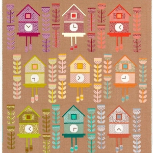 May include: A brown quilt featuring a repeating pattern of colorful birdhouses and stylized floral elements. The birdhouses have clock faces and are in shades of purple, red, yellow, green, and orange. The floral elements are in complementary colors.
