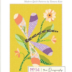May include: A quilt pattern by Tamara Kate, titled "Wondergarden", with a dragonfly design. The image shows a yellow background with a dragonfly illustration in orange, purple, and green, and the text "No. 14 | the Dragonfly".