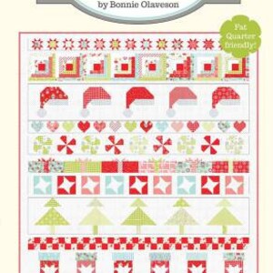 May include: A Christmas-themed quilt pattern titled "Cotton Way" by Bonnie Olaveson. The design features festive elements like Santa hats, stockings, and Christmas trees in red, green, and white. The pattern is labeled "Christmas Cheer" and includes the number #1012.