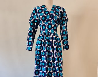 1970's Miss Hartnell printed long flutter sleeve maxi dress  in a bright blue Op Art print.