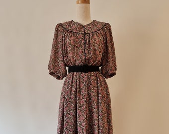 Japanese short sleeved floral dress is in a pretty black, taupe and musk pink all over ditzy rose print, curved yoke, full skirt, size 10.