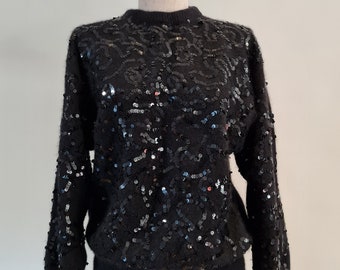 1980's Black Angora blend crew neck sweater with trailing all over sequin design on front and long sleeves.
