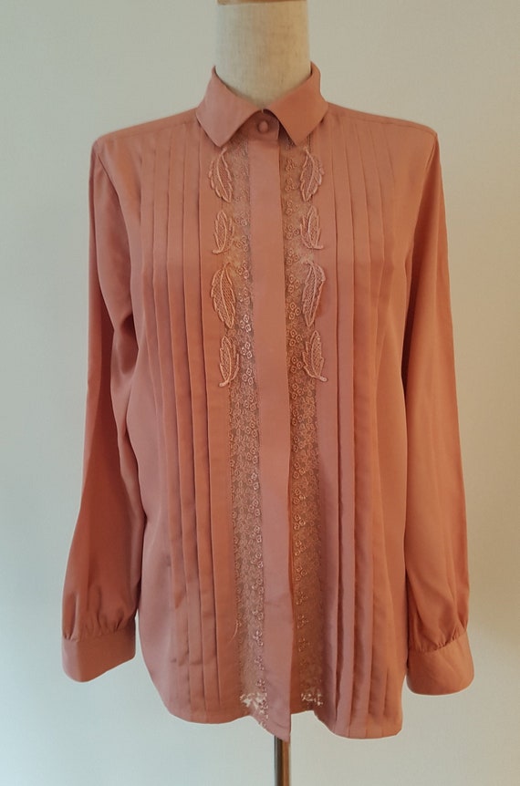 Nude,pintucked blouse with Lace and applique.