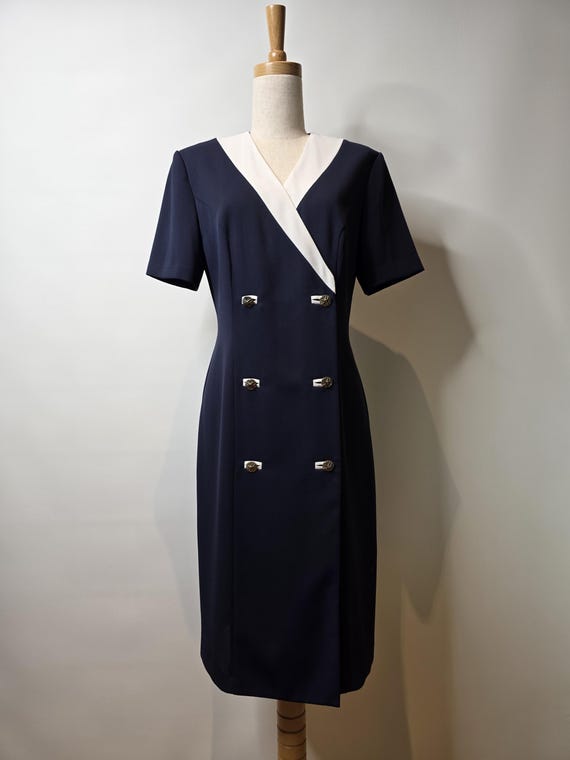 Stitches double breasted Navy and Cream tailored short sleeved dress with buttonhole details. Stitches double breasted Navy and Cream tailored short sleeved dress with buttonhole details.