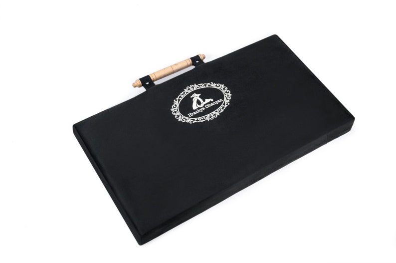 May include: Black rectangular storage case with a wooden handle and a white embroidered logo that says "Hunky Dory Crafts".