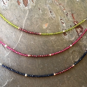 Gemstone bracelet made of peridot / ruby / sapphire with garnet & hematite beads