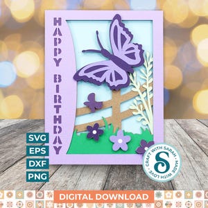 May include: A layered paper craft birthday card with a purple butterfly, flowers, and a fence. The words "HAPPY BIRTHDAY" are vertically aligned on the left. The card is framed in light purple, with a green and blue background.