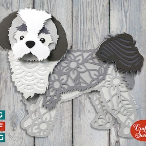 Può includere: Un ritaglio di carta grigio e bianco di un cane Shih Tzu con un design floreale. Il cane è in piedi su uno sfondo a grana di legno. L'immagine include il testo "Craft with Sarah".